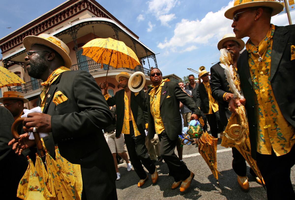 The Black Men of Labor, one of the numerous New Orleans social groups that take part in the annual New Orleans Jazz & Heritage Festival.