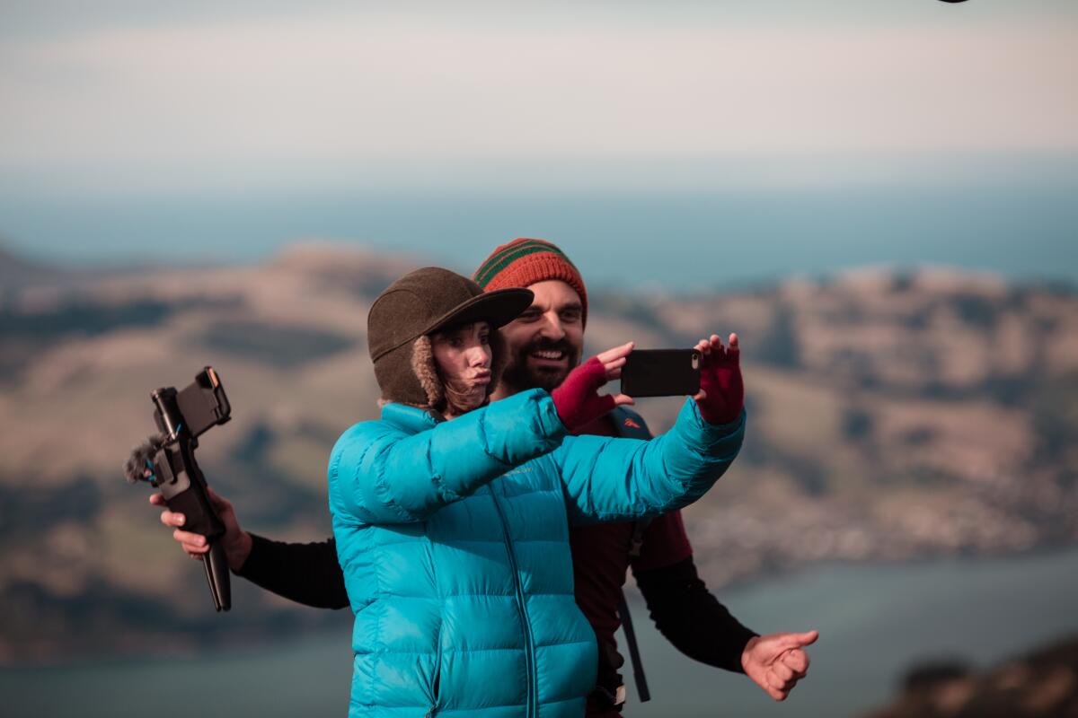Natalie Medlock, left, and Jan Oliver Lucks take a selfie
