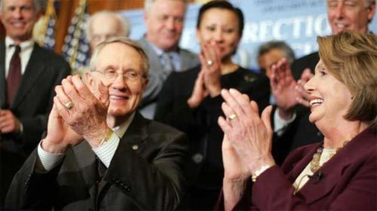 APPLAUSE: Senate Majority Leader Harry Reid and Speaker of the House Nancy Pelosi are all smiles after signing an energy bill that included the first congressional increase in vehicle fuel-economy standards in 32 years. President Bush is scheduled to sign it today.