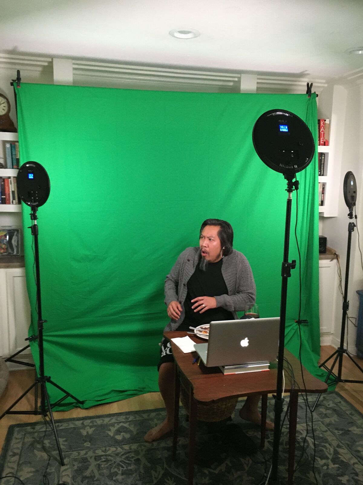 Feodor Chin performs online from his home during recording of the short play “A Fork in the Middle.”