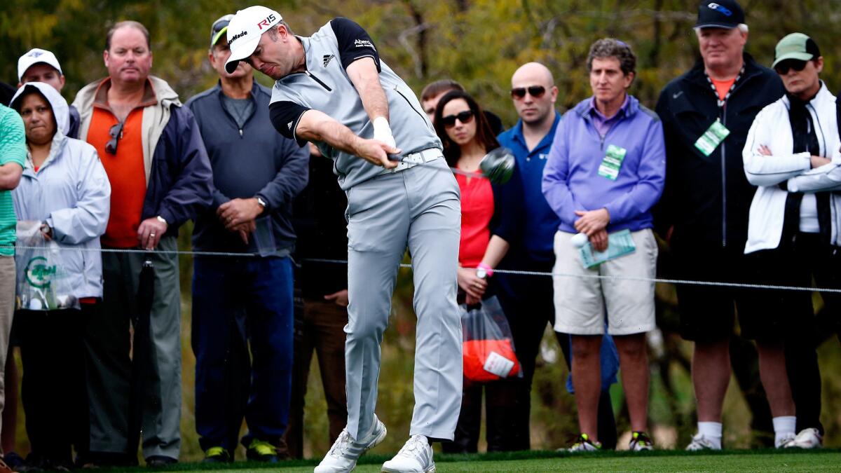 Martin Laird tees off on the ninth hole during the third round of the Phoenix Open on Saturday.