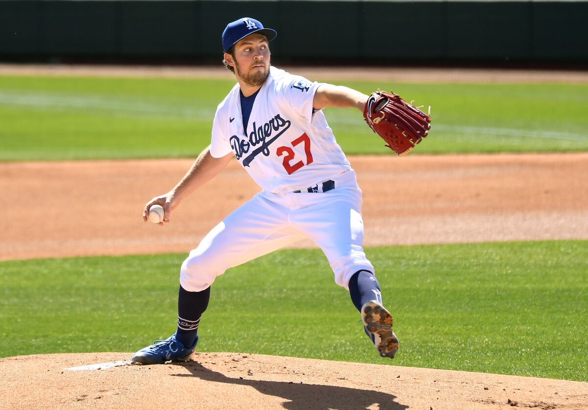 Dodgers pitcher Trevor Bauer delivers during a 2021 spring training game against the Colorado Rockies.