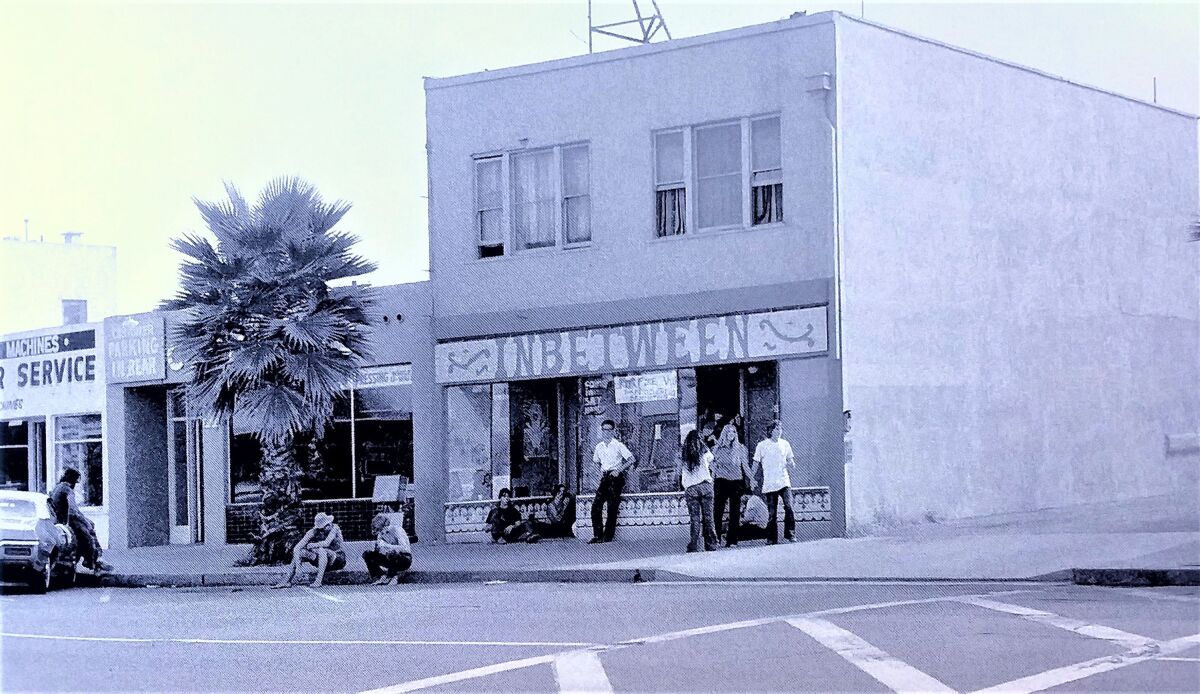 Young people gather on the street in front of The In-Between in Ocean Beach in 1969.