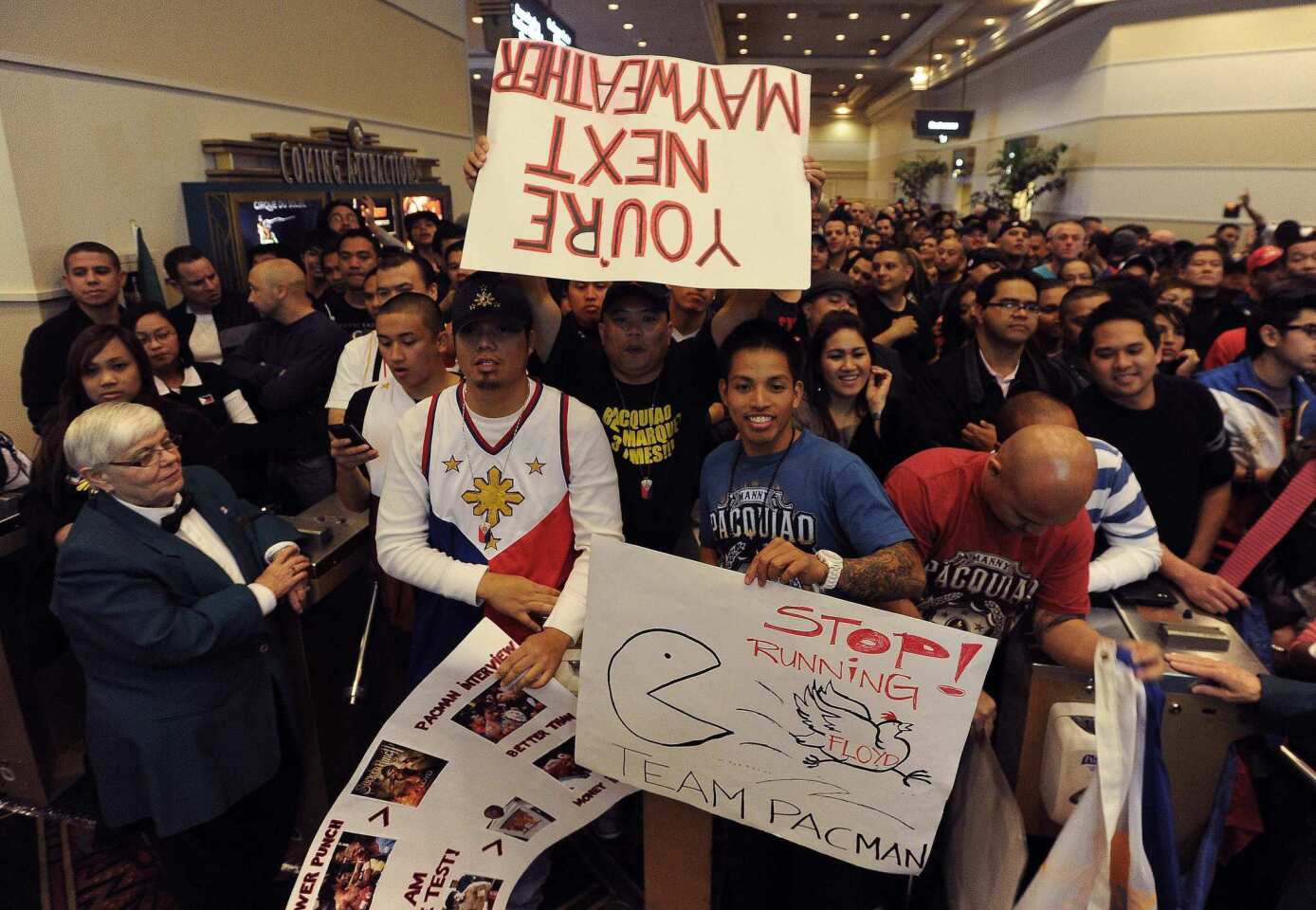 Boxing fans line up at the MGM Grand Garden Arena in Las Vegas on Friday before the official weigh-in for the Manny Pacquiao-Juan Manuel Marquez fight, which will take place Saturday night at the same venue.