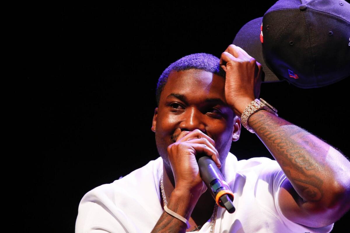 Meek Mill talks on stage during an event at Gramercy Theatre in New York City. he has a new e.p. "4/4."
