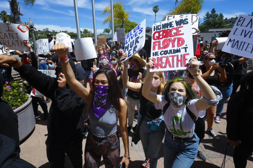 Protestors on Saturday protested in front of the La Mesa Police Department. The group eventually marched along the streets and gained access to Int. 8 where they temporary closed down traffic in both directions.