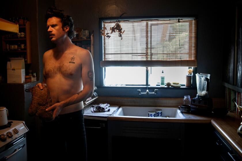 LOS ANGELES, CA--MARCH 13, 2017-- Singer Joshua Tillman, known by his stage name "Father John Misty," prepares to grab boiled water, while making coffee inside his Los Angeles, CA, home, March 13, 2017. Tillman has a new album, "Pure Comedy," and is set to play Coachella next month. (Jay L. Clendenin / Los Angeles Times)