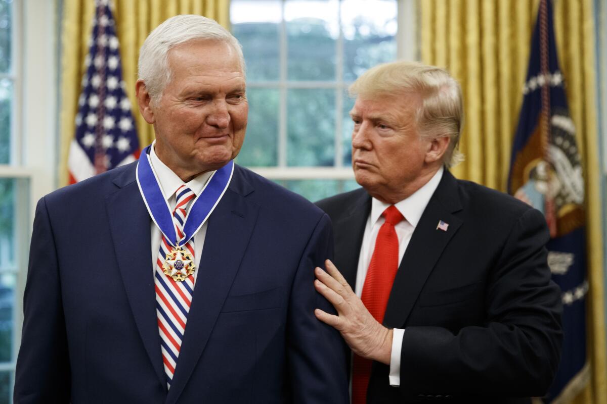 President Donald Trump presents the Presidential Medal of Freedom to former Laker and general manager Jerry West, in the Oval Office of the White House on Thursday in Washington. 