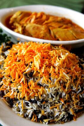 Addas polo has raisins, lentils, dates and saffron mixed with basmati rice.