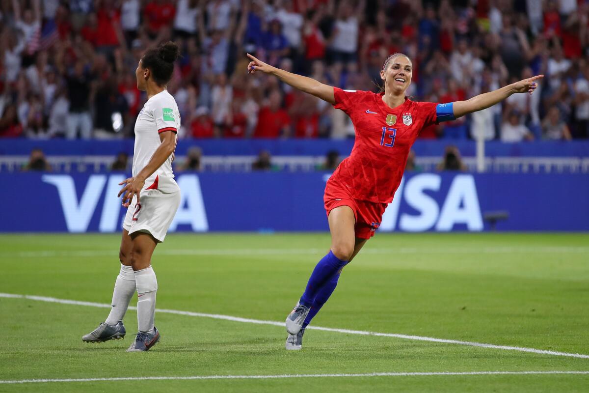 Alex Morgan celebrates after scoring against England during the Women's World Cup semifinals Tuesday in Lyon, France.