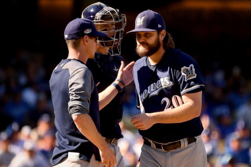 LOS ANGELES, CALIFORNIA OCTOBER 17, 2018-Brewers pitcher Wade Miley is pulled form the game by manger Craig Counsell in the 1st inning against the Dodgers in Game 5 of the NLCS at Dodger Stadium Wednesday. (Wally Skalij/Los Angeles Times)