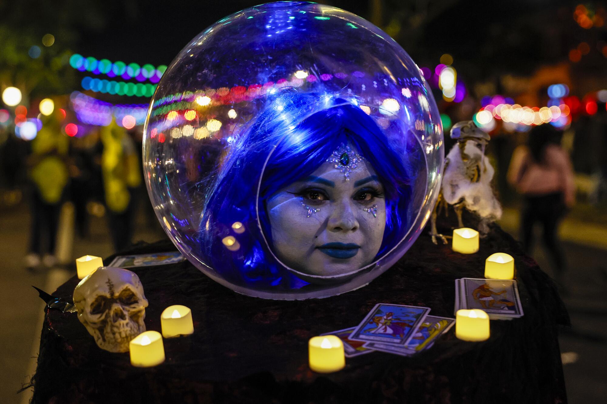 Daisy Cobos dressed as "Madame Leota," the witch from Disneyland's Haunted Mansion ride.   