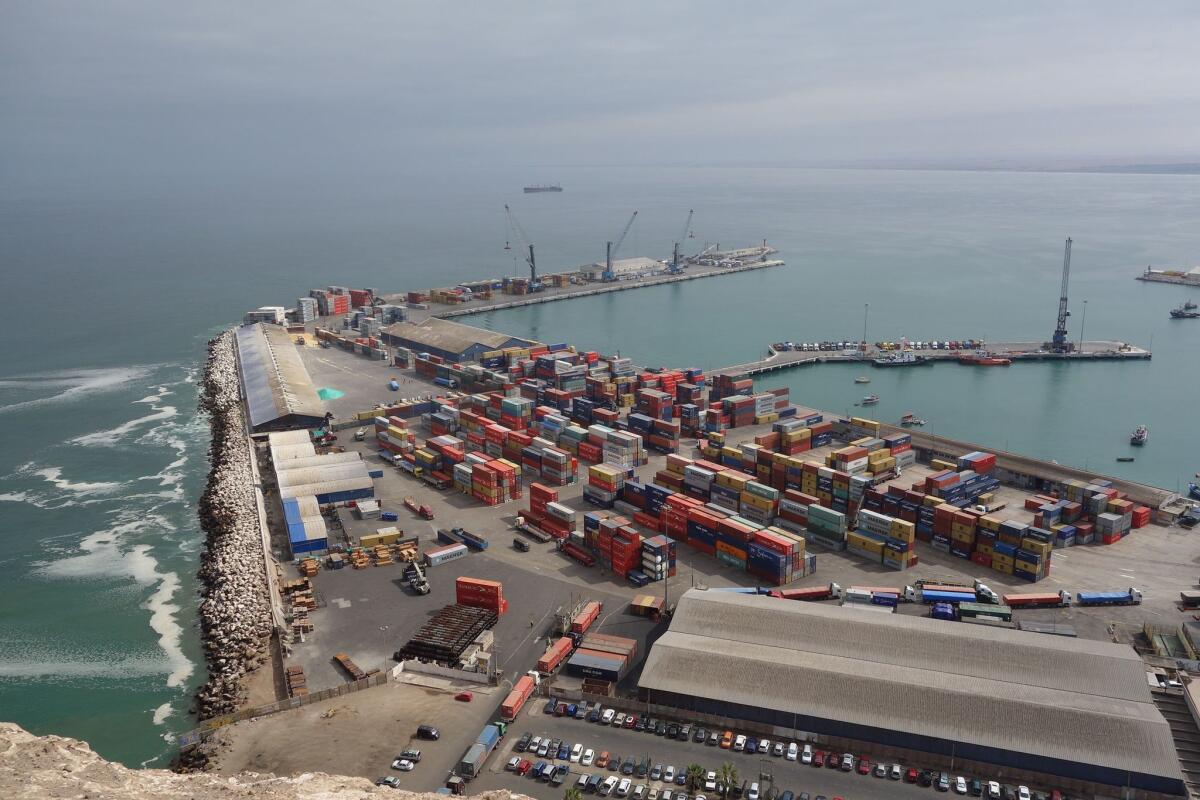 An overhead view of the port of Arica, Chile, showing Bolivian cargo containers waiting to be loaded for shipment. Chilean officials claim drug traffickers operating in Bolivia use a treaty exempting Bolivian cargo from inspection to ship cocaine hidden in containers.