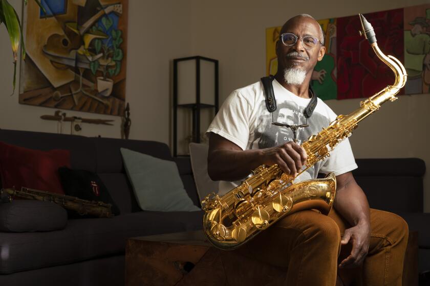 ENCINITAS, CA - FEBRUARY 3: Saxophonist, flutist, and periodic vocalist, who has toured with the Rolling Stones, Karl Denson is celebrating the 25th anniversary of his band, Karl Denson's Tiny Universe this month. Photographed at his home, February 3, 2023. (Howard Lipin / For The San Diego Union-Tribune)