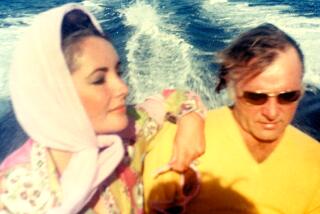 Elizabeth and Richard Burton in 1967 on board a speedboat along the coast of Sardinia, Italy.