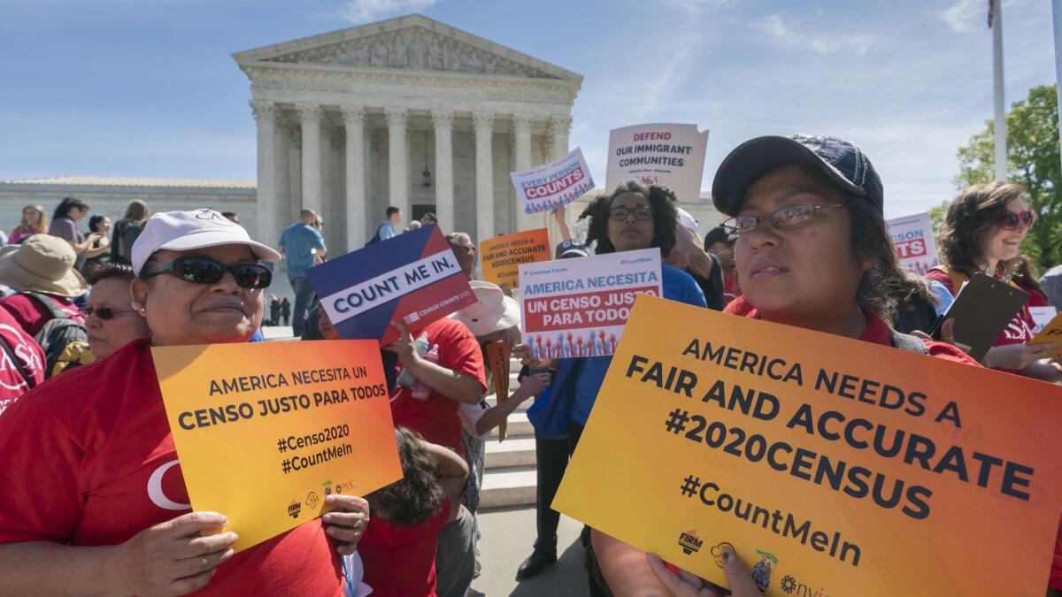 Immigration activists rally outside the Supreme Court as the justices hear arguments over the Trump administration's plan to ask about citizenship on the 2020 census on April 23.