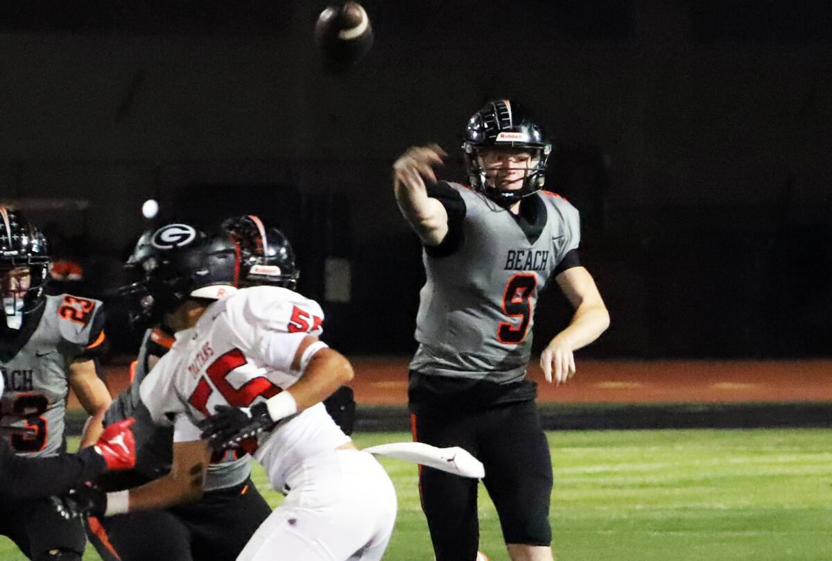 Huntington Beach's Brady Edmunds (9) throws a pass against Glendora on Friday in a CIF Division 6 playoff game.