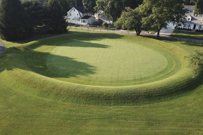 FILE - A 155-foot diameter circular enclosure around hole number 3 at Moundbuilders Country Club at the Octagon Earthworks in Newark, Ohio, is pictured July 30, 2019. The Ohio Supreme Court ruled Wednesday, Dec. 7, 2022, that the state's historical society can proceed with efforts to gain control of a set of ancient ceremonial and burial earthworks currently maintained by the country club. (Doral Chenoweth III/The Columbus Dispatch via AP, File)