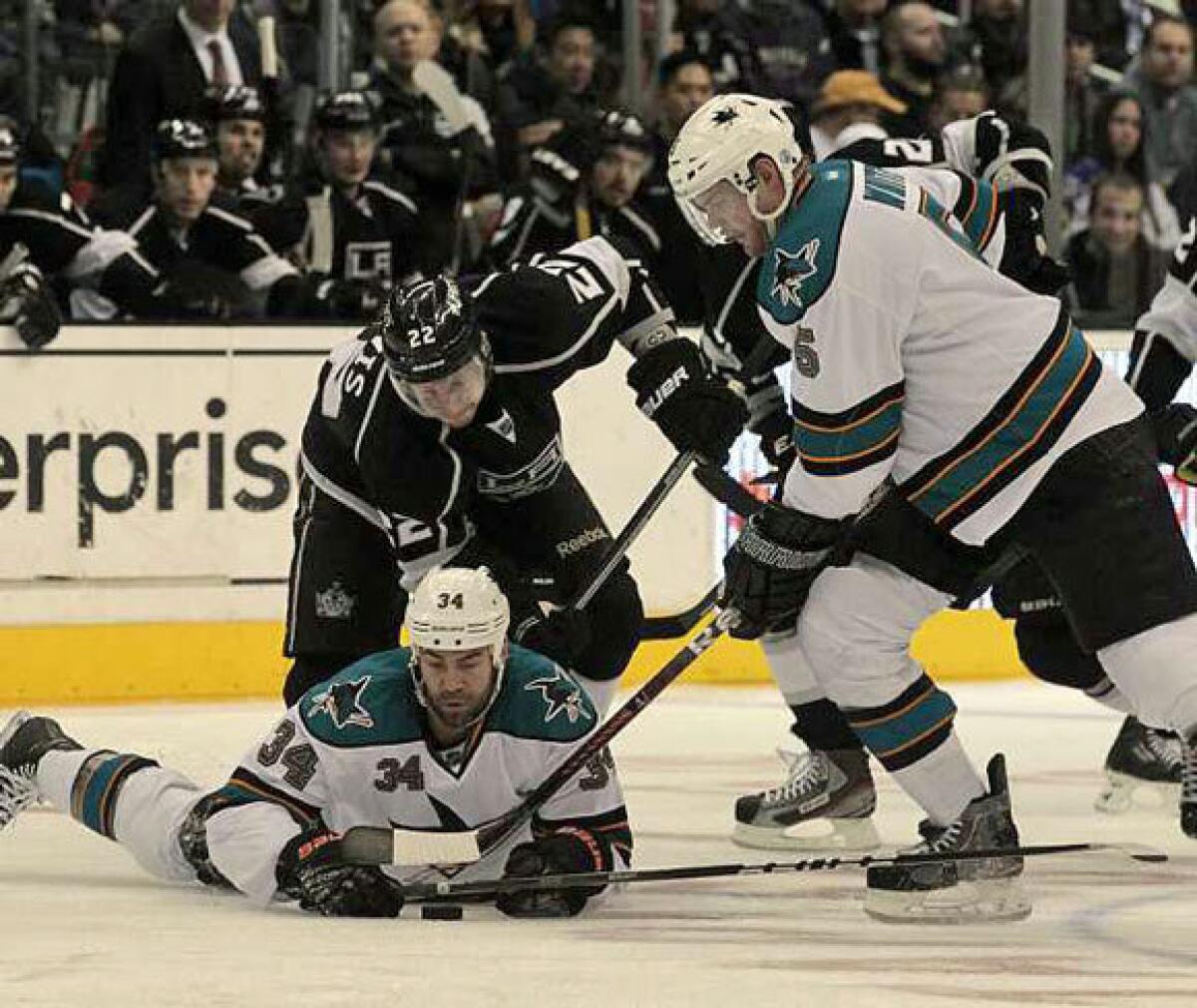 Daniel Winnik is sprawled across the ice while playing against the Ducks last season.