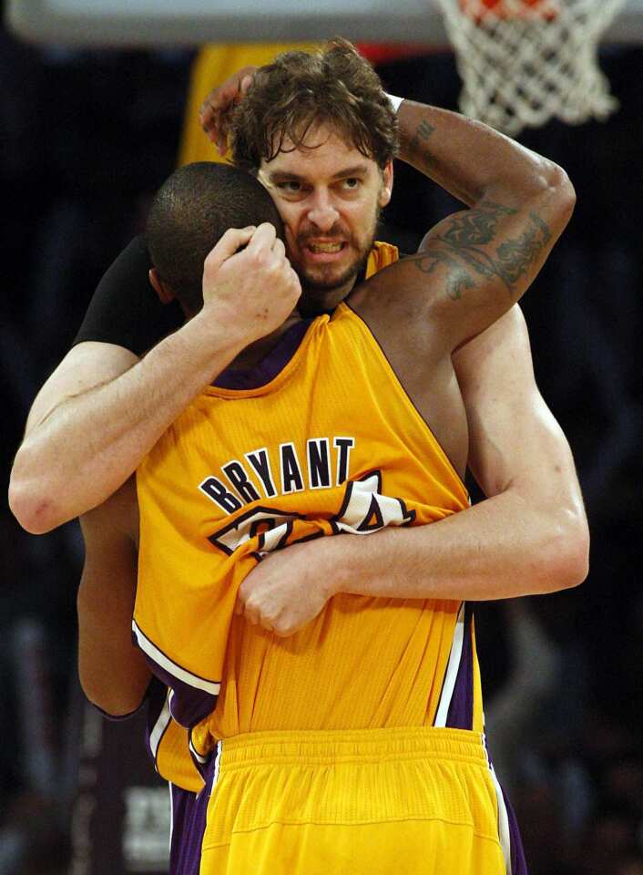 Guard Kobe Bryant embraces power forward Pau Gasol after assisting on Gasol's basket that put the Lakers ahead, 91-82, at the end of the third quarter Friday night at Staples Center.