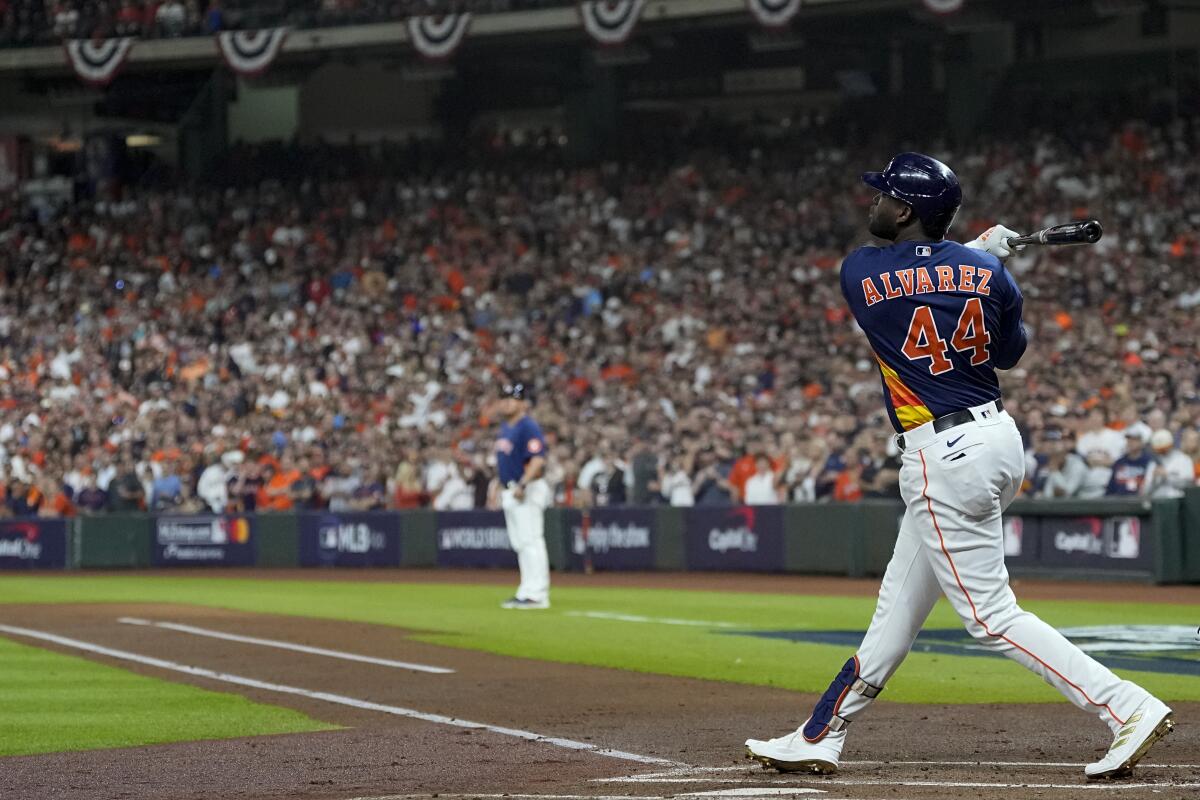 The Astros' Yordan Alvarez hits an RBI double during the first inning in Game 2 of the World Series on Oct. 29, 2022.