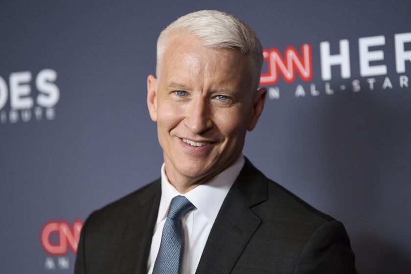 FILE - In this Dec. 9, 2018 file photo, host Anderson Cooper attends the 12th annual CNN Heroes: An All-Star Tribute at the American Museum of Natural History, in New York. Cooper has a 2-book deal and plans for collaborating with historian-novelist Katherine Howe. Harper announced Tuesday, March 19, 2019, that the CNN anchor and "60 Minutes" correspondent will work on two books of nonfiction with Howe, who specializes in novels about witchcraft, including "The Daughters of Temperance Hobbs" and "The Physick Book of Deliverance Dane." (Photo by Evan Agostini/Invision/AP, File)