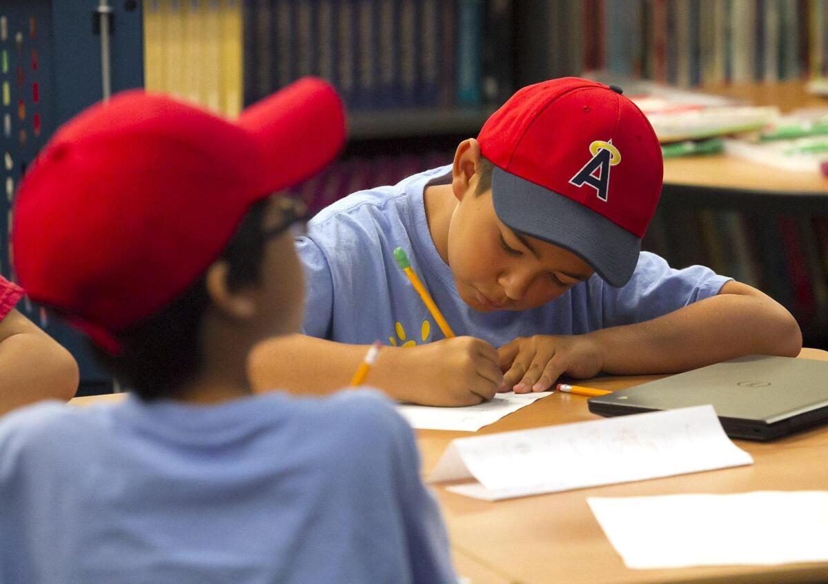 Students in the Science of Baseball class study the Pythagorean theorem and look at Angel stadium.