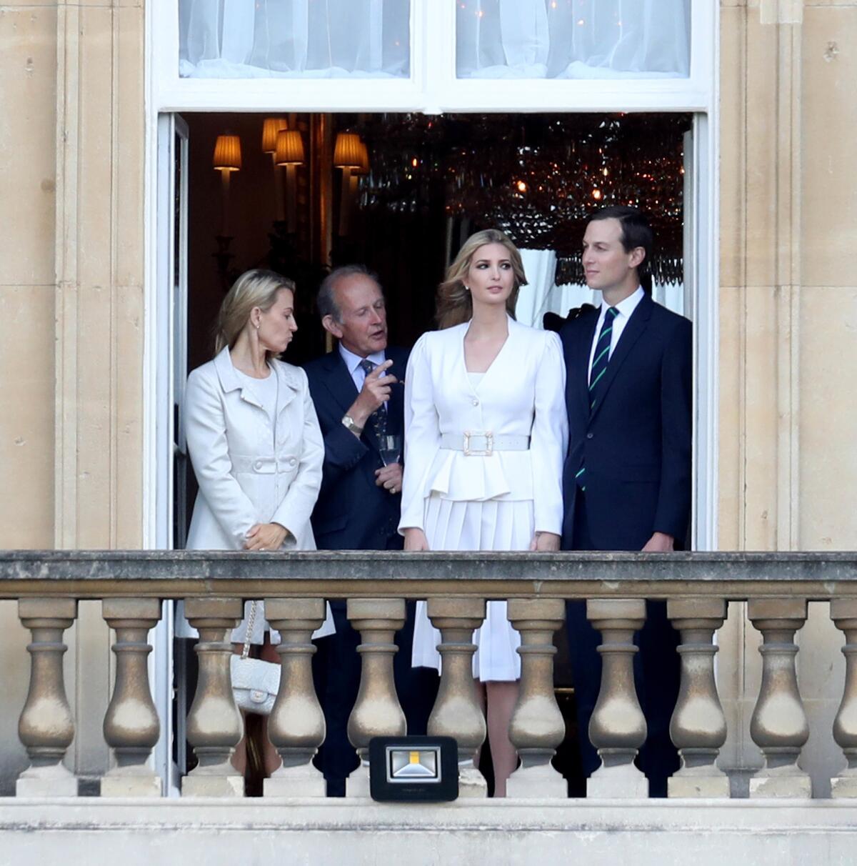 Ivanka Trump and Jared Kushner, right, look out of a window at Buckingham Palace during the visit of President Trump and First Lady Melania Trump on June 3, 2019.