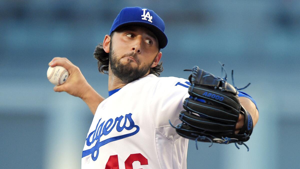 Dodgers starter Mike Bolsinger delivers a pitch during the first inning of a 9-5 loss to the San Francisco Giants at Dodger Stadium on Friday.