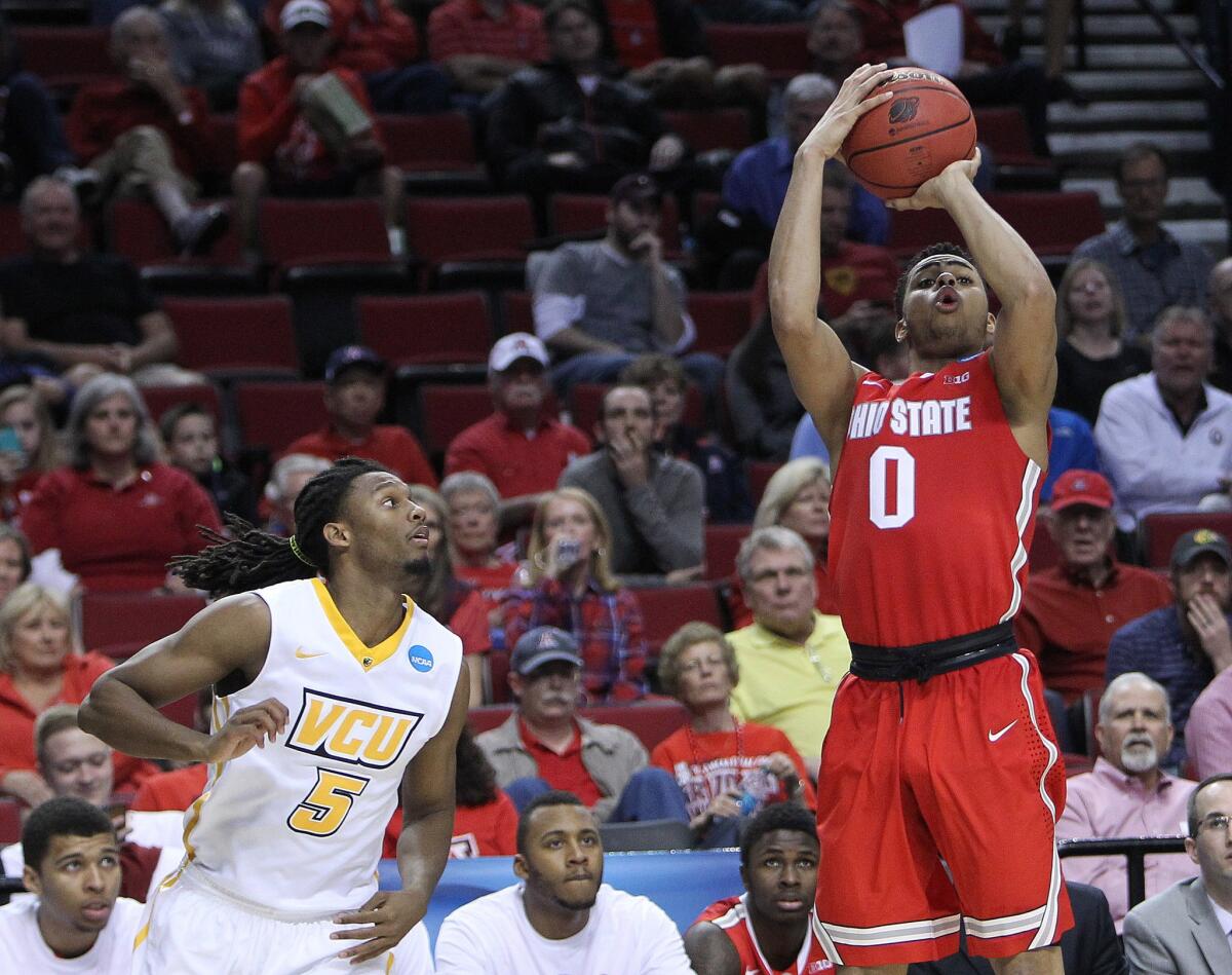 Ohio State point guard D'Angelo Russell scored 28 points in the Buckeyes' NCAA tournament overtime victory over Virginia Commonwealth.