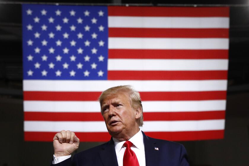 President Donald Trump acknowledges the crowd after speaking at a campaign rally, Thursday, Aug. 15, 2019, in Manchester, N.H. (AP Photo/Patrick Semansky)