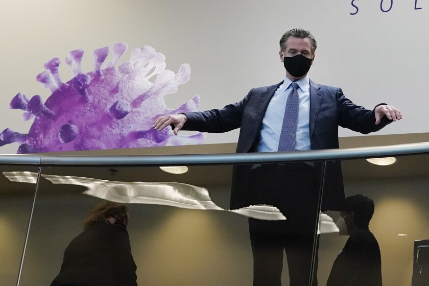 California Gov. Gavin Newsom tours a coronavirus testing facility