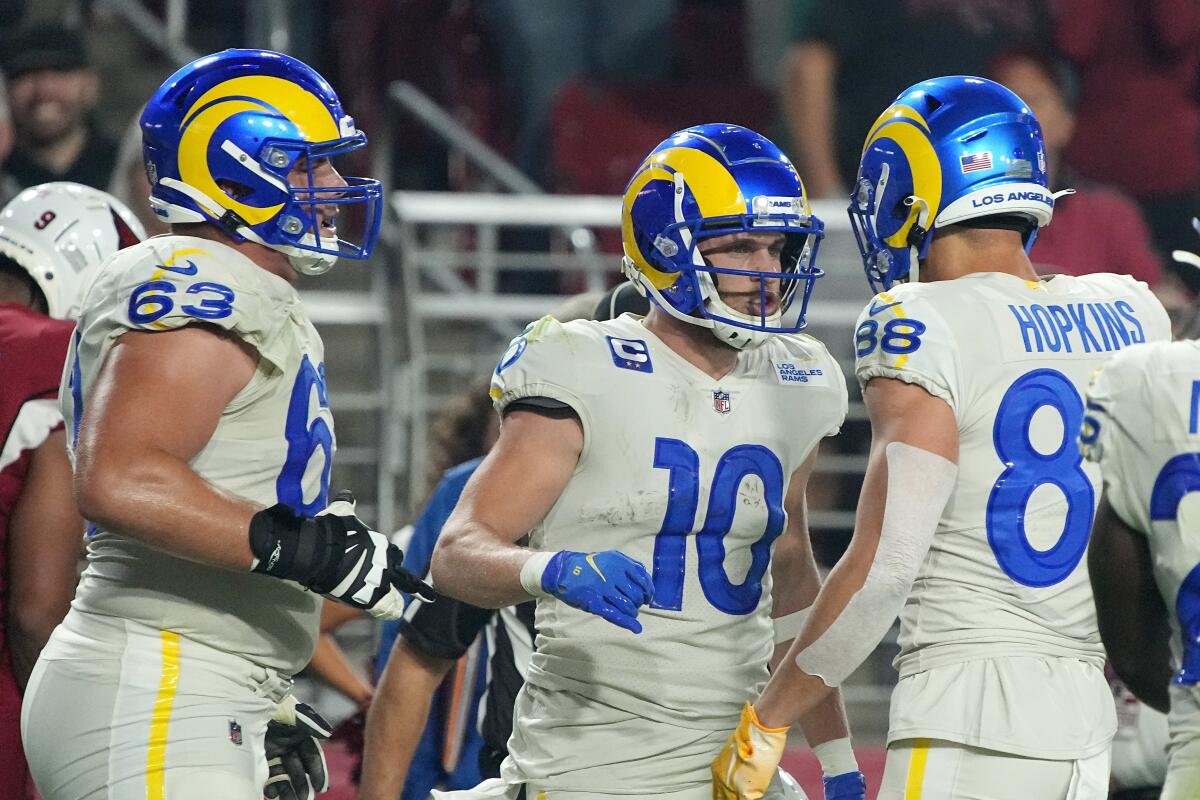 Rams wide receiver Cooper Kupp celebrates his touchdown against the Arizona Cardinals with teammates.