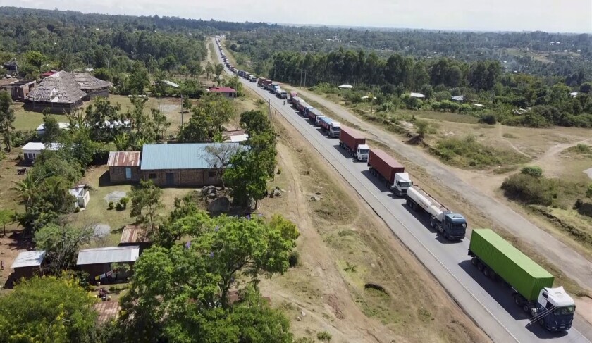 In this image made from video, a view of queues of trucks near Bungoma, Kenya, close to the border with Uganda, on Wednesday, Jan. 19, 2022. A dispute over COVID-19 testing fees for truckers crossing from Kenya has created a fuel crisis in Uganda, highlighting an economic impact of the pandemic in a landlocked country with virtually no fuel reserves of its own. (AP Photo)