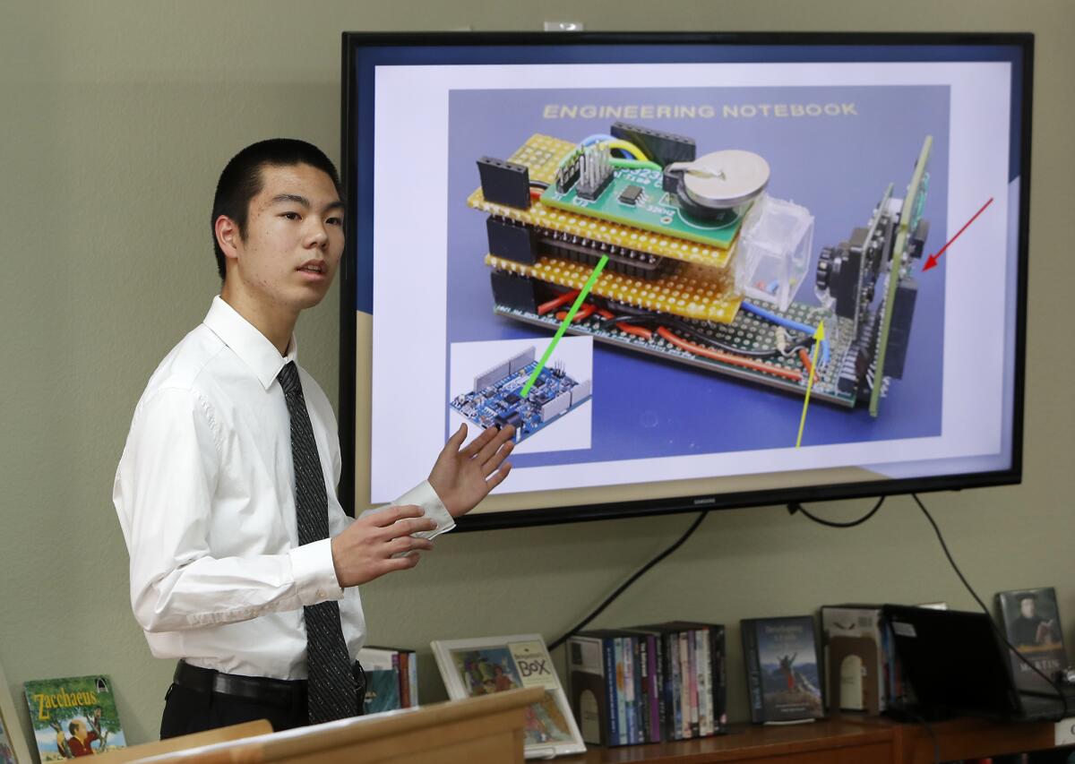 Brethren Christian High School junior Andrew Shiroma, 17, talks Thursday during a presentation by the school's International Space Station program team about its experiment that spent more than a month on the space station earlier this year.