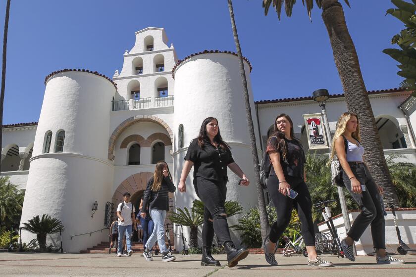 SAN DIEGO, April 24, 2019 | Students walk from Hepner Hall while at San Diego State University in San Diego on Wednesday. | (Photo by Hayne Palmour IV / The San Diego Union-Tribune)