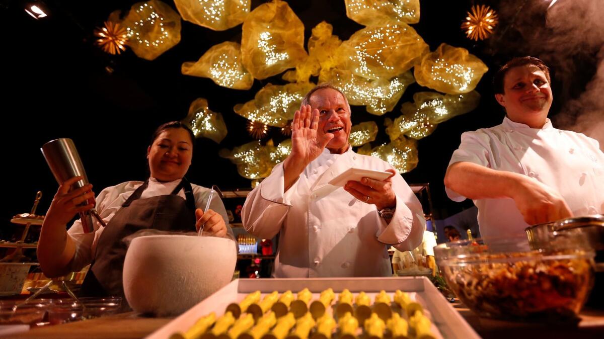 Chef Wolfgang Puck, center, talks about his creations for the 89th Oscars Governors Ball press preview.