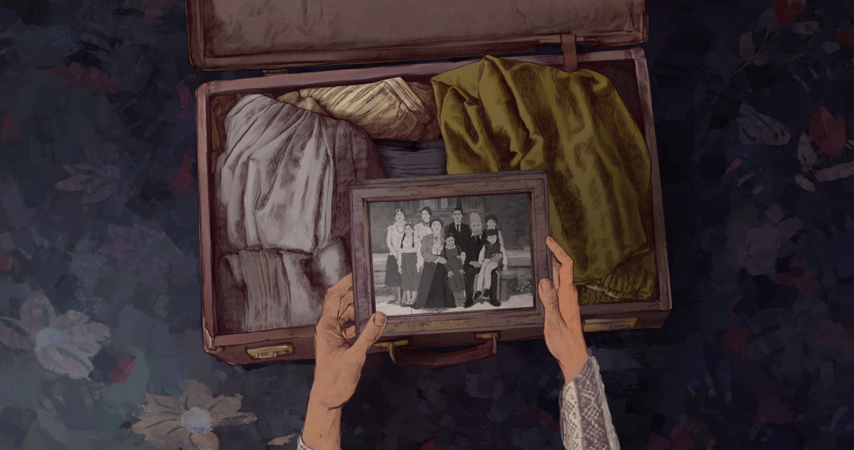 hands holding a framed family photo above an open suitcase