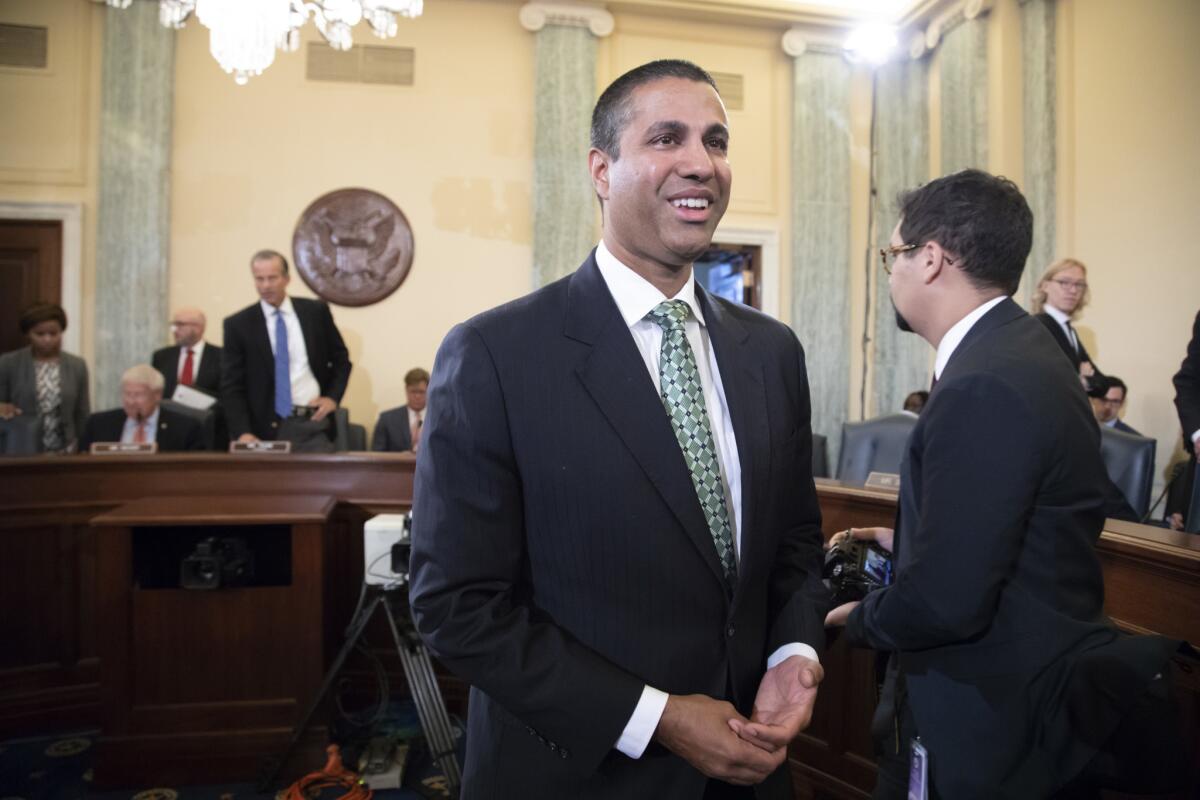 FCC Chairman Ajit Pai prepares to testify before a U.S. Senate committee on Aug. 16.