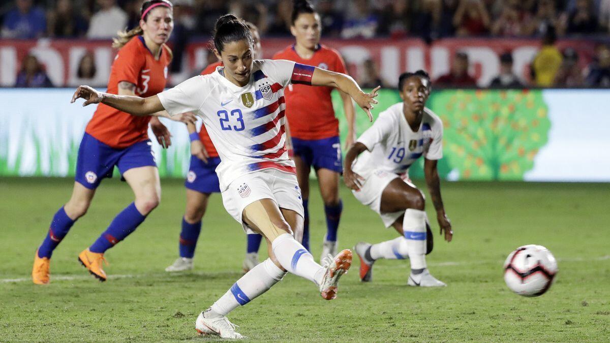 United States' Christen Press scores on a penalty kick against Chile during the first half of an international friendly soccer match Friday at the StubHub Center.