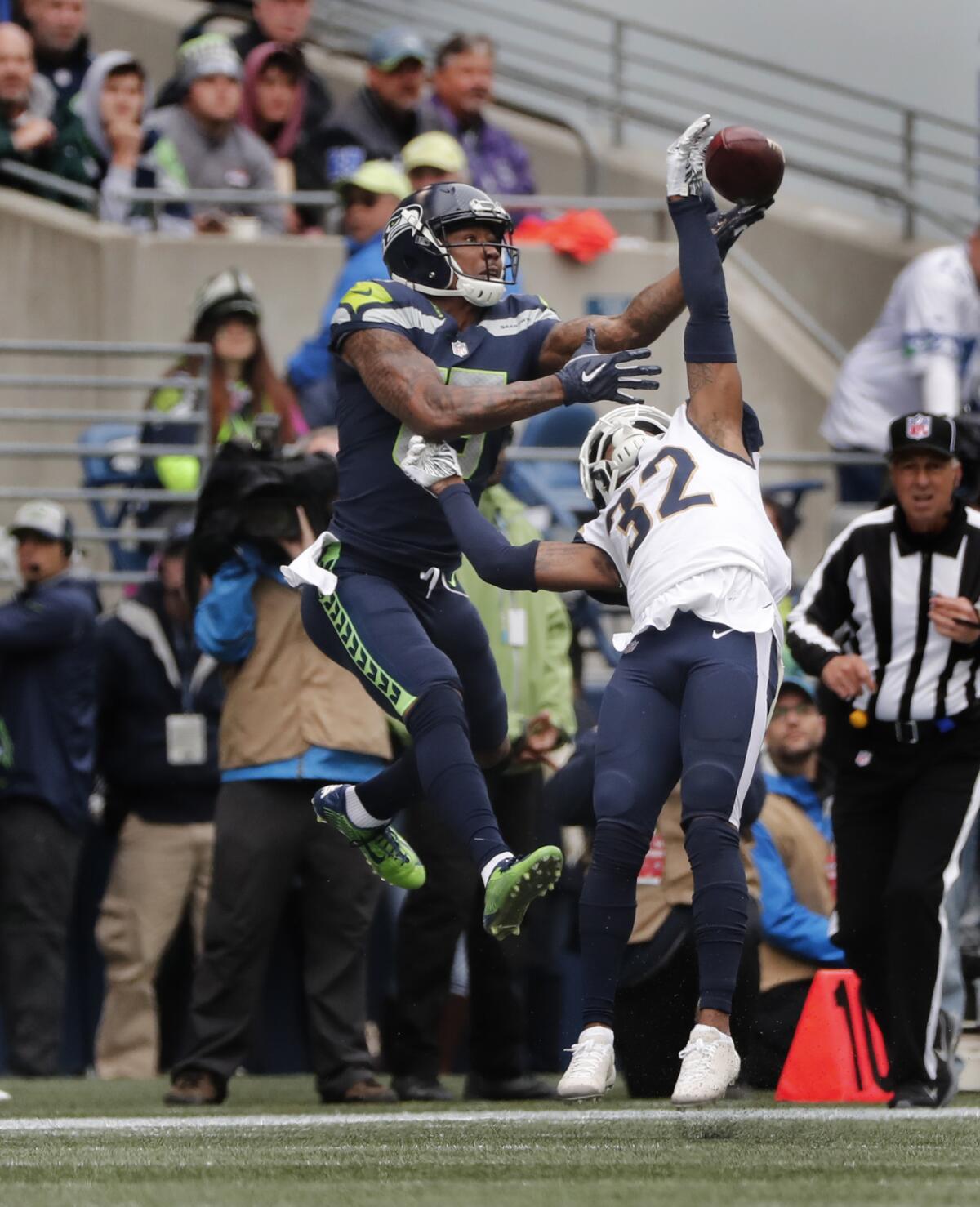 Rams cornerback Troy Hill (32) blocks a pass intended for Seattle Seahawks wide receiver Brandon Marshall (15) in the first half at CenturyLink Field on Sunday in Seattle.
