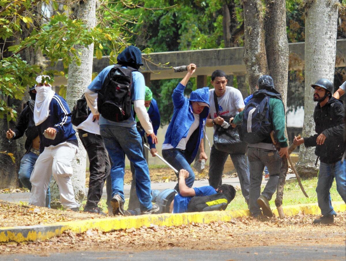 Pro-government assailants beat a student at the Central University of Venezuela on Thursday. A university official said the campus, in Caracas, had been invaded by motorcycle-riding vigilantes at least 10 times since student-led government protests began sweeping the country in early February.