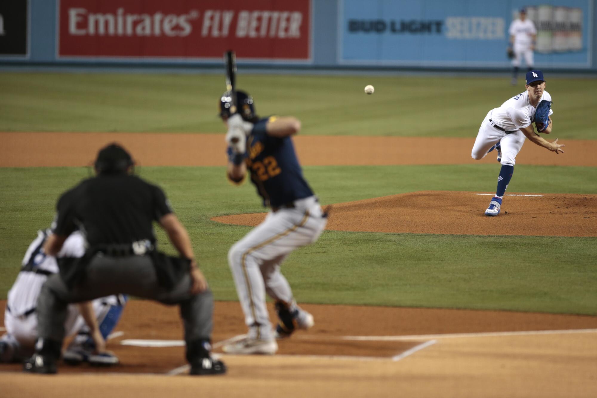 Dodgers pitcher Walker Buehler delivers to Milwaukee Brewers right fielder Christian Yelich during the first inning.