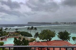 This photo provided by the U.S. Coast Guard overlooking Noverlooking Tumon Bay in Guam, as Super Typhoon Mawar closes in on Tuesday, May 23, 2023. Residents of Guam are stockpiling supplies, battening down windows and abandoning wood and tin homes for emergency shelters as Super Typhoon Mawar bears down as the strongest storm to approach the U.S. Pacific territory in decades. ( Lt. Junior Grade Drew Lovullo/US Coast Guard via AP)