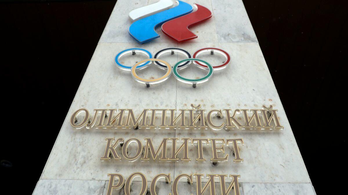 The logo of the Russian Olympic Committee looms over the entrance of the head office in Moscow.