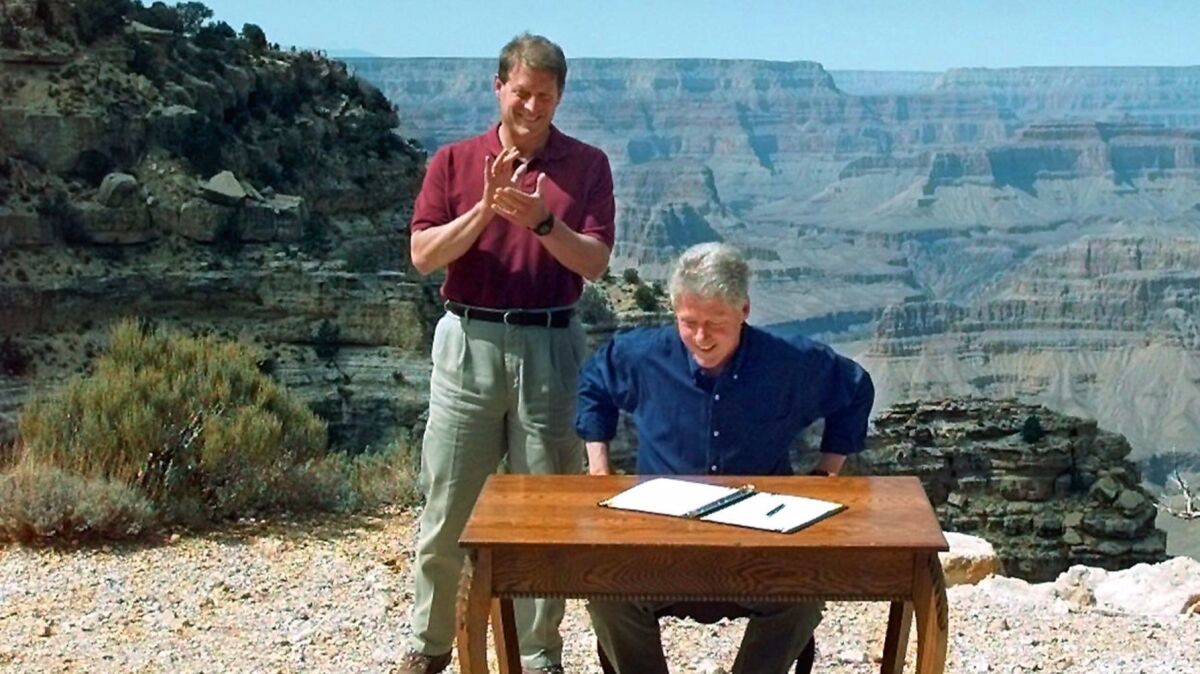 Vice President Al Gore applauds after President Clinton signed a bill designating the Grand Staircase-Escalante National Monument in 1996.