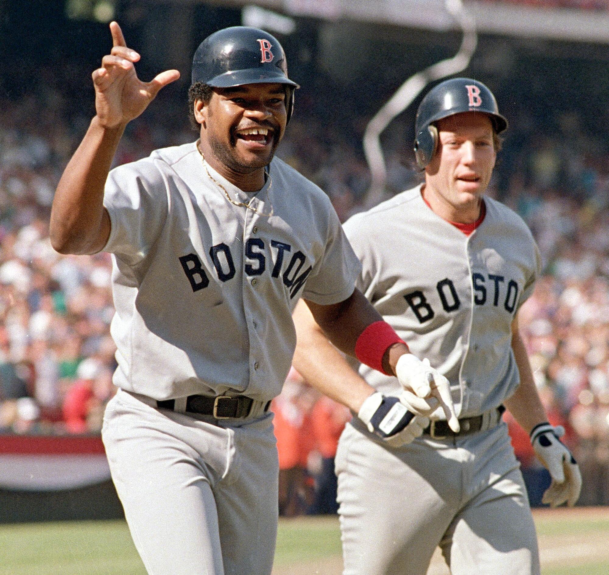 Dave Henderson, left, and Rich Gedman of the Boston Red Sox cheer after Henderson's ninth-inning homer.