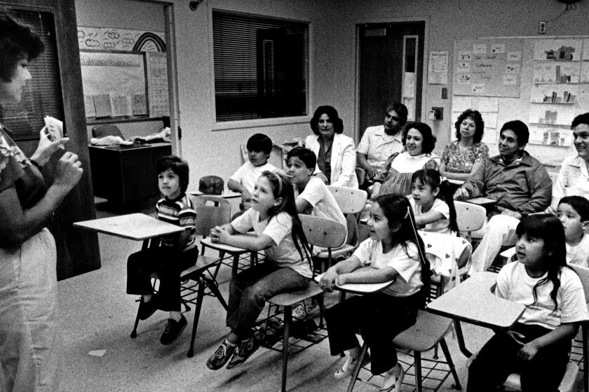 June 28, 1983: Yolanda Gonzalez teaches Saturday Roselana class; some of the parents are seated at the back. Class was at Pasadena City College.