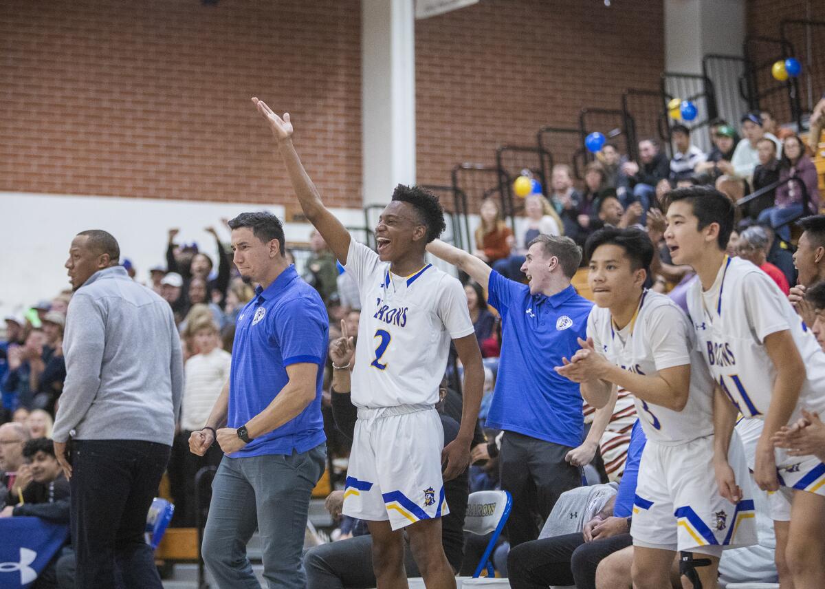 Fountain Valley's bench celebrates as the host Barons defeat Temple City in the second round of the CIF Southern Section Division 3A playoffs on Friday.