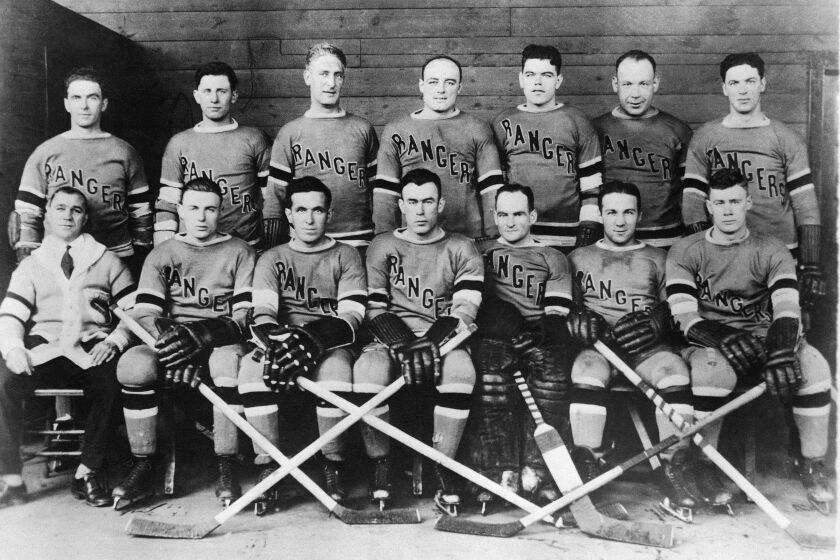 FILE - The New York Rangers, members of the National Hockey League, pose for a photo in 1928 in New York. From left to right, top row: Billy Boyd, Butch Keeling, manager Lester Patrick, Ching Johnson, Myles Lane, Taffy Abel and Paul Thompson. From left to right, bottom row: trainer Harry Westerby, Murray Murdock, Frank Boucher, Bill Cook, John Ross, Leo Bourgault and Bunny Cook. Abel was one of the first known Native American players in the NHL. (AP Photo/File)
